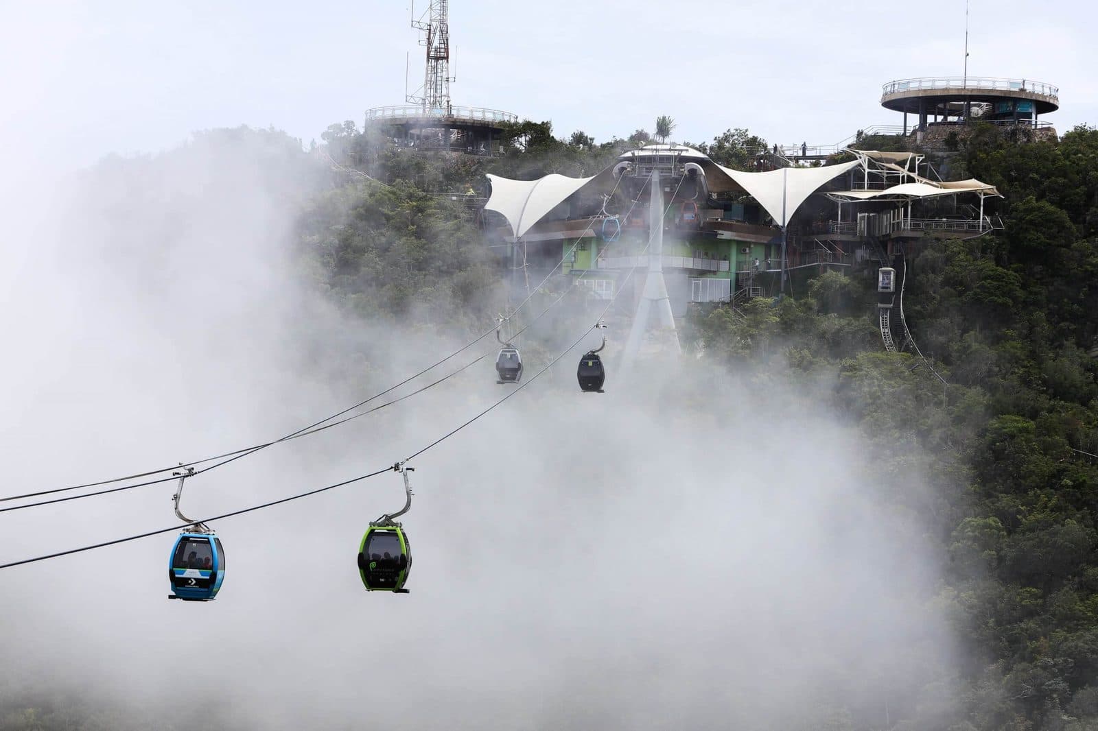 Langkawi SkyCab gondolas in clouds — 708m above sea level